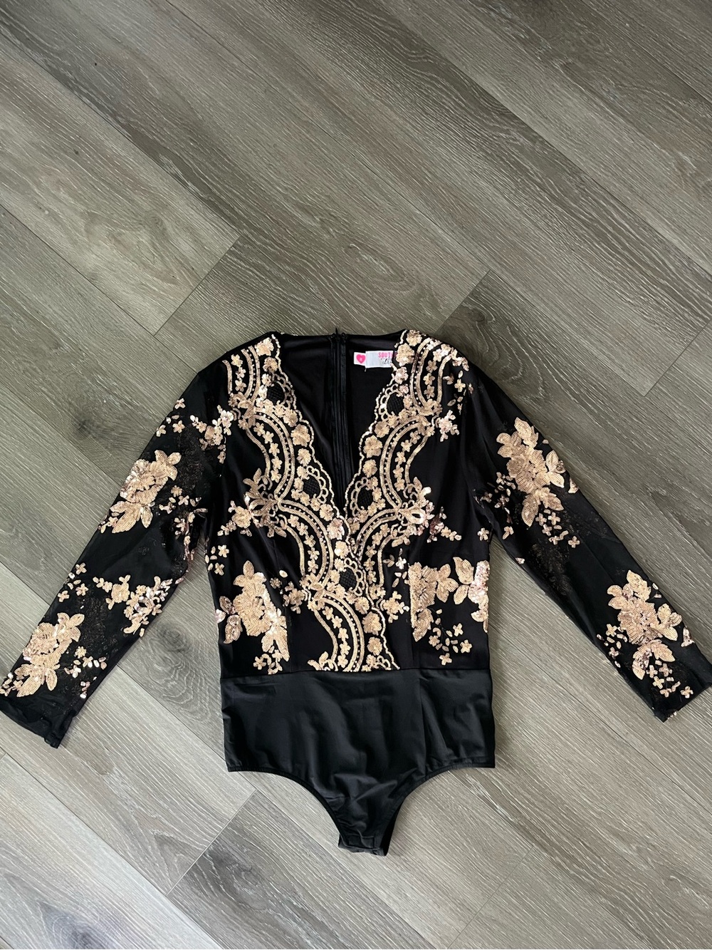 long sleeve black and rose gold sequin bodysuit